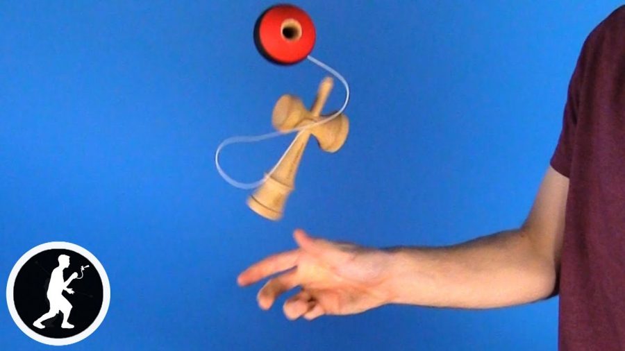 This is an image of the kendama trick “ken flip.“