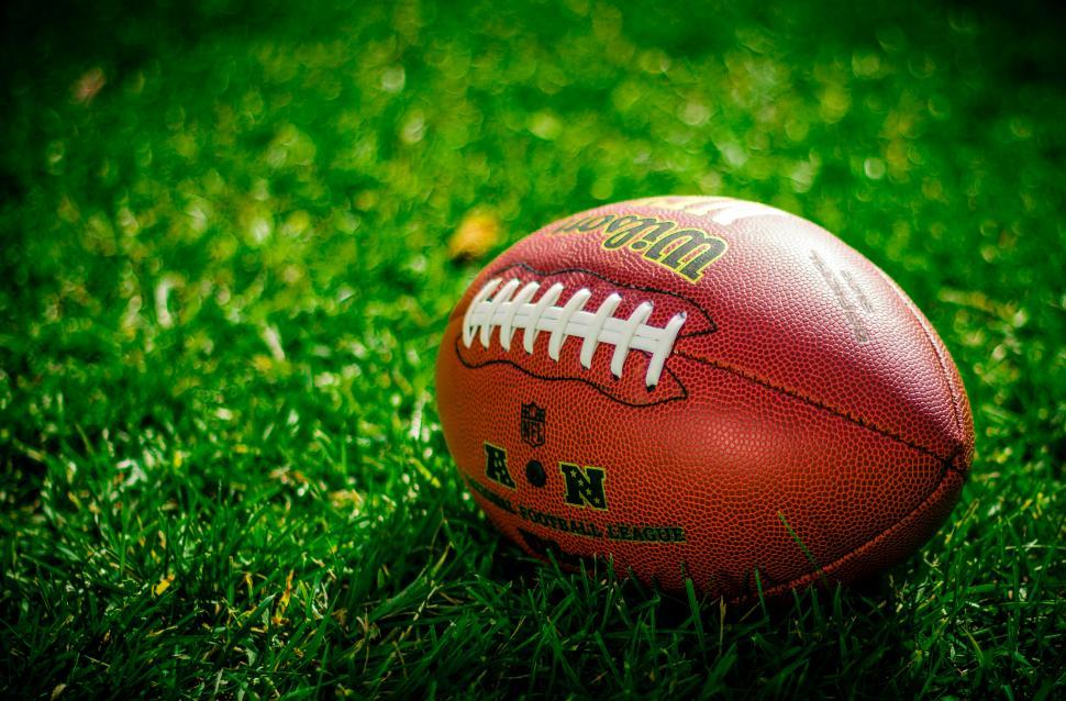 https://freerangestock.com/photos/163840/close-up-of-an-american-football-on-grass.html 